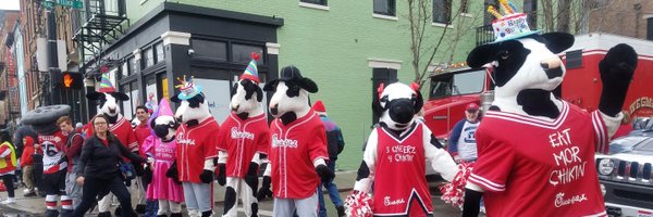 Chick-fil-A Cows On Parade At Findlay Market Opening Day Parade. Herd of Cows crossing the street Beetles Abbey Road style.